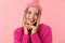 Image of positive beautiful blonde girl wearing hat and sweater smiling