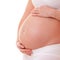 Image of pregnant woman touching her big belly. Close up. Motherhood, pregnancy, people and expectation concept. Pregnant woman