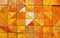 This image presents a warm, inviting background of geometric tiles in rich orange hues. The seamless pattern exudes a