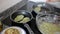 Image of process frying zucchini pancakes in frying pan in kitchen