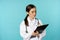 Image of professional woman doctor, physician with clipboard writing, listening patient at hospital clinic appointment