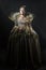 The image of Queen Elizabeth I of the 16th century on a black background. Historical reconstruction