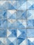 This image radiates elegance with its geometric tiles set against a crisp, light blue background. The refreshing hue and