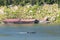 Image of raft floating on the water and long tail boat