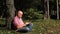 Image with a Relaxed Businessman in Park Texting Using Cellphone Wireless Network