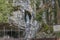 Image of the replica of the Virgin of Lourdes in a natural grotto