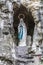Image of the replica of the Virgin of Lourdes in a natural grotto
