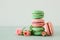 Image of romantic colorful macaron or macaroon over pastel background.