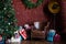 Image of room with Christmas decorations, spruce with decorations, leather armchair