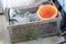 Image of Rope, fishnet and orange bucket in the wooden box of the fisherman boat