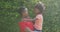 Image of roses over happy african american mother and daughter hugging in garden
