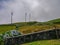 Image of a row of wind mills during unsettled weather