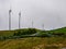 Image of a row of wind mills during unsettled weather