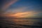 Image of a sandy beach at sunset