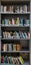 Image of shelf used as a small bookcase with various books put in order