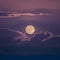 Image Shiny full moon shines through cirrostratus clouds in mesmerizing scene