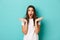 Image of shocked and anxious brunette woman in white t-shirt, spread hands sideways and gasping alarmed, standing over