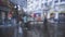 Image shot through raindrops falling on wet glass,abstract blurs of traffic - monsoon stock image of Kolkata formerly Calcutta