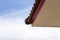 the image shows a gable of a house infront of the blue sky