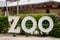 Image of a sign which reads Zoo