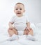 Image of a sitting nine-month-old baby on a white background