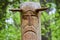 The image of the Slavic deity Veles carved from a tree trunk on a neo-Pagan temple in the forest