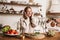 Image of smiling nice woman using headphones while cooking dinner