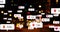 Image of social media icons and numbers over out of focus city and traffic lights