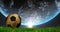 Image of spinning globe over football ball on grass