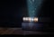 image of stack of antique books over wooden table and dark background.