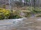 image of a steep river and mossy coastline, the texture of the water gives the feeling of something soft