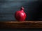 Image of Still Life with Pomegranate. Dark wood background, antique wooden table