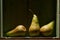 Image of Still Life with a stack of green Pears. Rustic wood background, antique wooden table