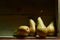 Image of Still Life with a stack of green Pears. Rustic wood background, antique wooden table