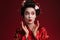 Image of surprised young geisha woman in traditional japanese kimono