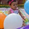 Image of sweet baby girl in a wreath, closeup portrait of cute 12 months old smiling girl, toddler, Adorable little baby girl, smi