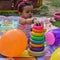 Image of sweet baby girl in a wreath, closeup portrait of cute 12 months old smiling girl, toddler, Adorable little baby girl, smi