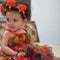 Image of sweet baby girl in a wreath, closeup portrait of cute 12 months old smiling girl, toddler, Adorable little baby girl, smi