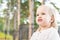 Image of sweet overweight baby girl looking away from camera. Close up portrait of a child. Cute toddler portrait.