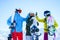 Image of three athletes in helmet doing handshake at snow resort .