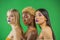 Image of three beautiful smiling women of different nation: European, African-American and Asian girls with bared