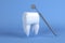 Image of a tooth on a blue background with a dentist tool. 3D rendering