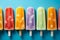 Image Top view of colorful popsicles on blue background, vibrant assortment