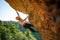 Image of tourist man in helmet clambering up