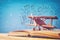 image of toy airplane and book over wooden table with set of back to school infographics