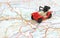 Image travel concept, small red, black car on map
