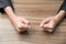 Image of two businesswoman\'s fists on a wood table