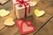 Image of Valentine`s day, symbols of love, gift box on a background of wooden planks. 2