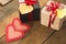 Image of Valentine`s day, symbols of love, gift boxes on a background of wooden planks.