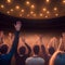 image of the a vast crowd of hands, illuminated by a dreamy and foggy light towards the front auditorium.